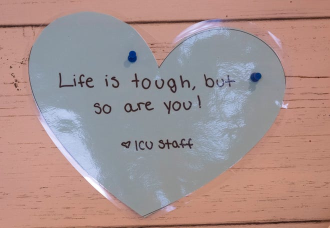 An inspirational message is pinned to a bulletin board behind the nurse's station in the intensive care unit at Aurora West Allis Medical Center in West Allis.