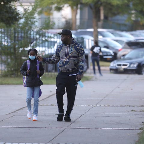 Kamora Porchea, first grader, walks into School 45