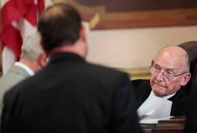 Pike County Common Pleas Judge Randy Deering conferences with attorneys during a Sept. 10, 2021 hearing.
