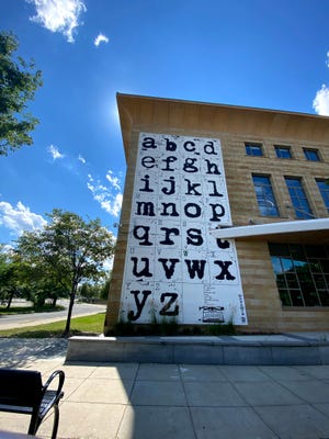 A stylish alphabet mural on the side of the Worcester Public Library.
