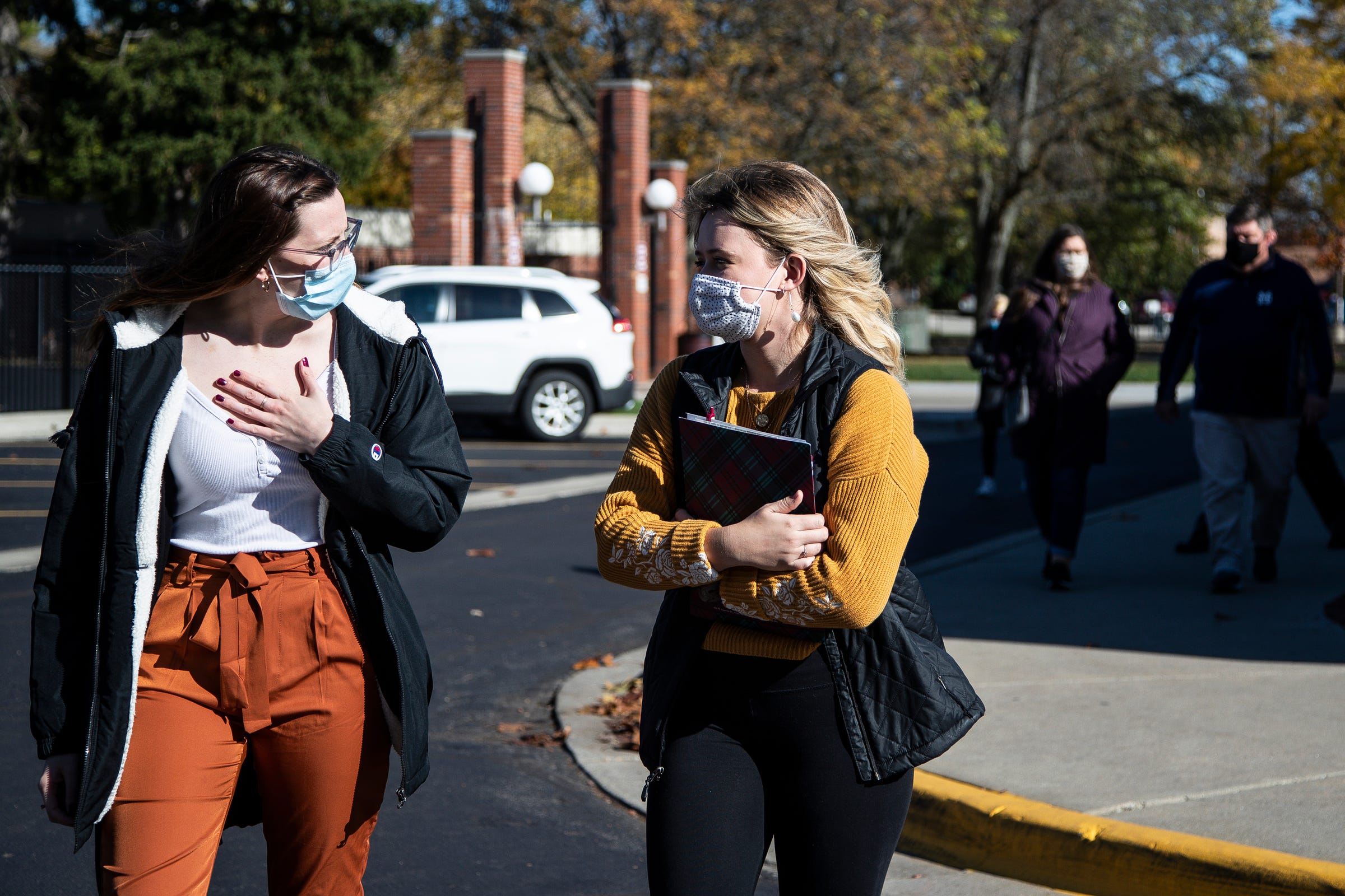 Alma student and tour guide Abigail Killian, left, talks to Bailey Graham, of Norton Shores, during a campus tour at Alma College in Alma on Wednesday, Oct. 28, 2020.