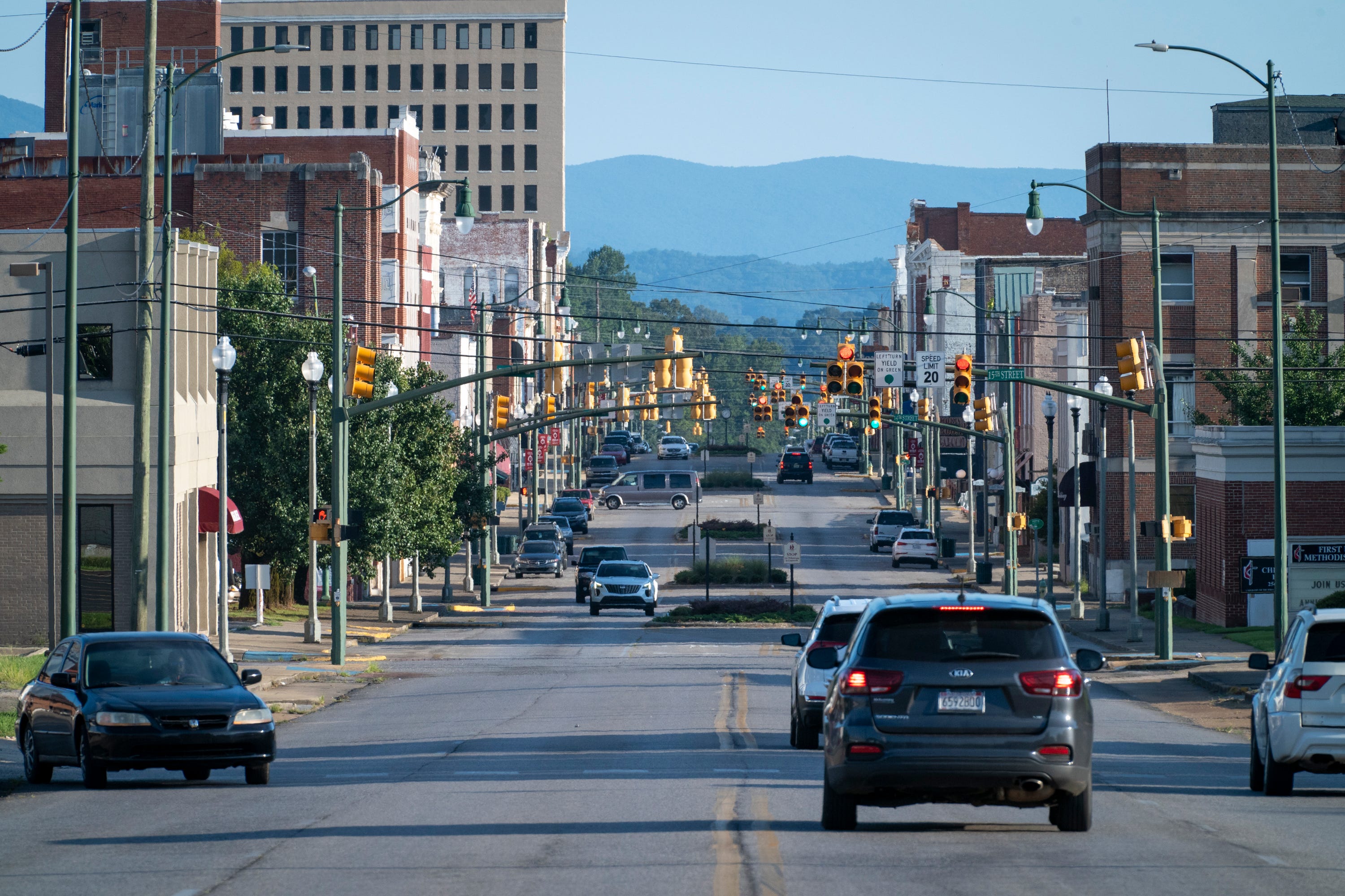 Cars pass down Noble street in downtown Anniston, Ala., on August 13, 2021. Eleven days into the Freedom Rides aimed at ending segregation, Hank Thomas and other Freedom Riders huddled on a bus on May 14, 1961, just outside Anniston, Alabama, as a white mob slashed tires on their bus, pounded it with tire irons and then threw a firebomb inside. As flames spread, the civil rights activists scrambled off the bus into the angry crowd that beat them with bats, fists and those same tire irons. That brutal confrontation could have ended the group’s 14-day mission to desegregate public interstate accommodations. Instead, more Freedom Riders boarded buses headed into hostile territory. The rides focused attention on the violent resistance to segregation and are credited with helping integrate accommodations.