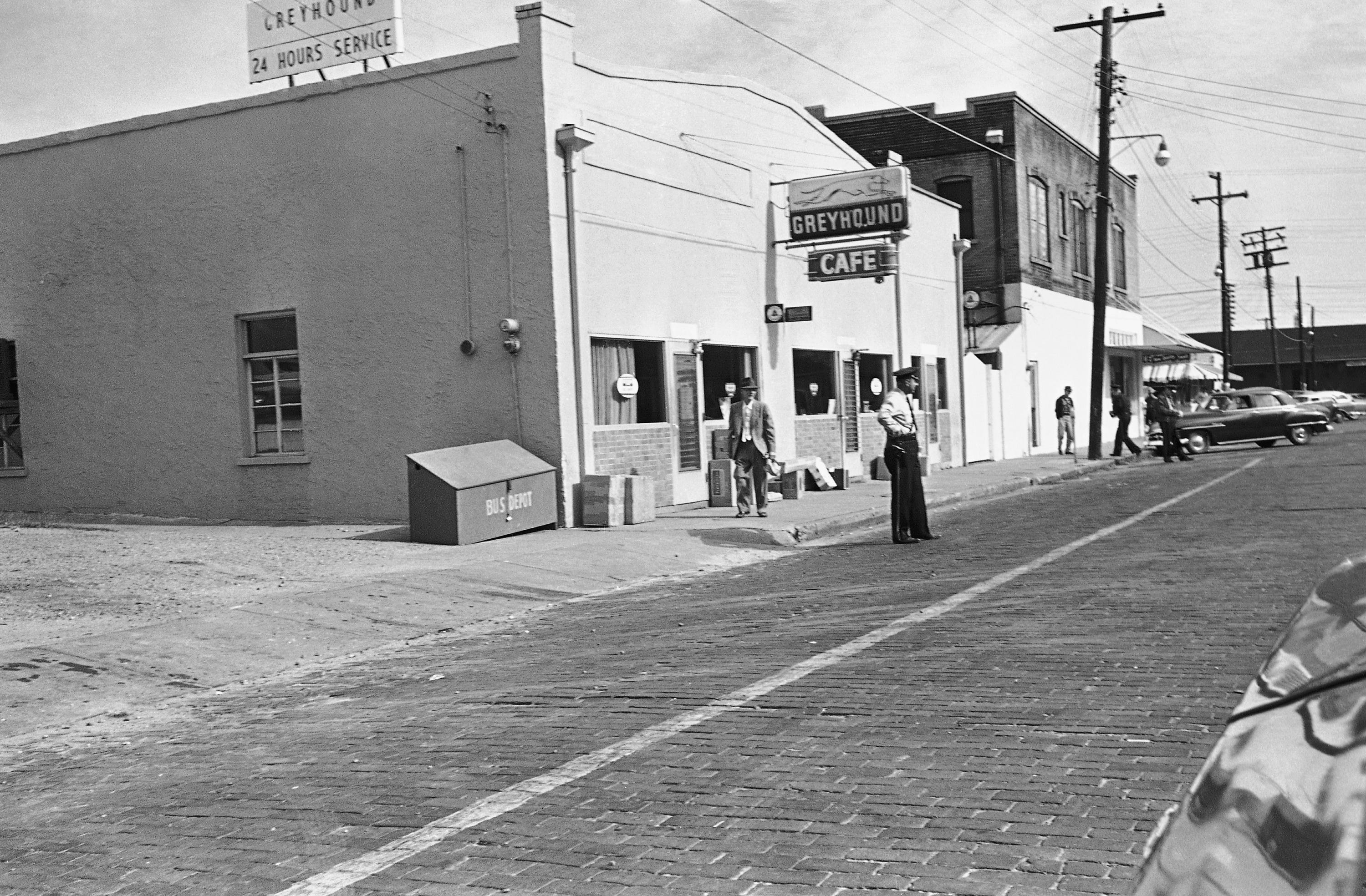  city policeman stands in front of the bus station in McComb, Dec. 1, 1961, as a bus load of "Freedom Riders" was expected to arrive and test the racial barriers at the bus station. Several Blacks were beaten when they tried to get lunch counter service at the station on Wednesday.