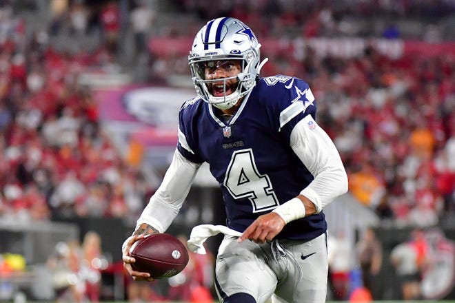 Dak Prescott #4 of the Dallas Cowboys carries the ball during the second quarter against the Tampa Bay Buccaneers at Raymond James Stadium on September 09, 2021 in Tampa, Florida.