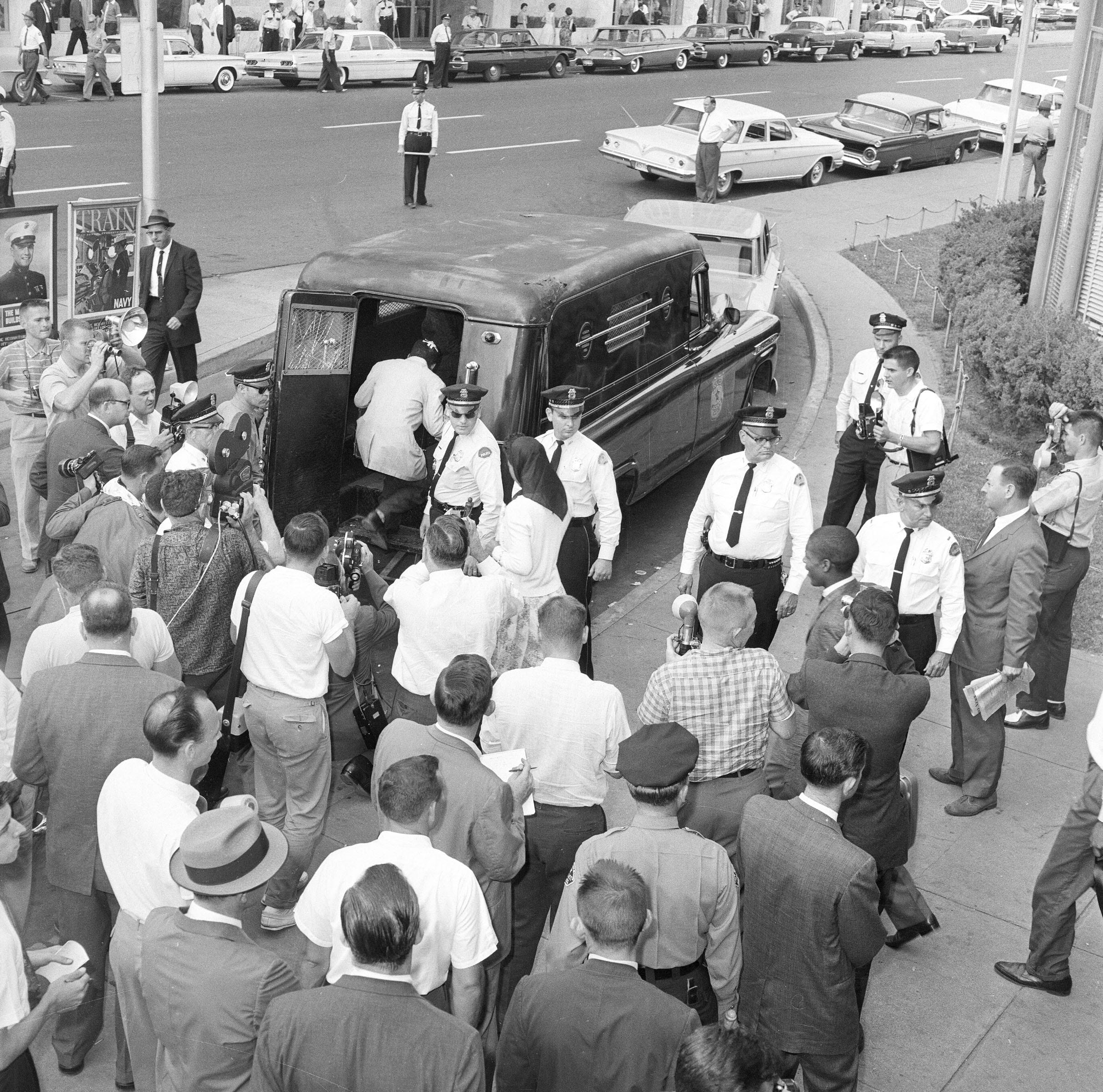 Fifteen Freedom Riders that arrived on a second bus in Jackson, Miss., are loaded into a paddy wagon at the bus station, May 24, 1961.  They entered the "whites only" waiting room and were arrested for being in violation of state laws. 