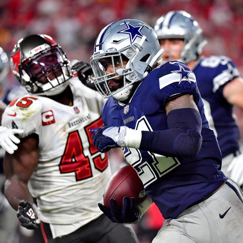 Ezekiel Elliott of the Dallas Cowboys carries the 