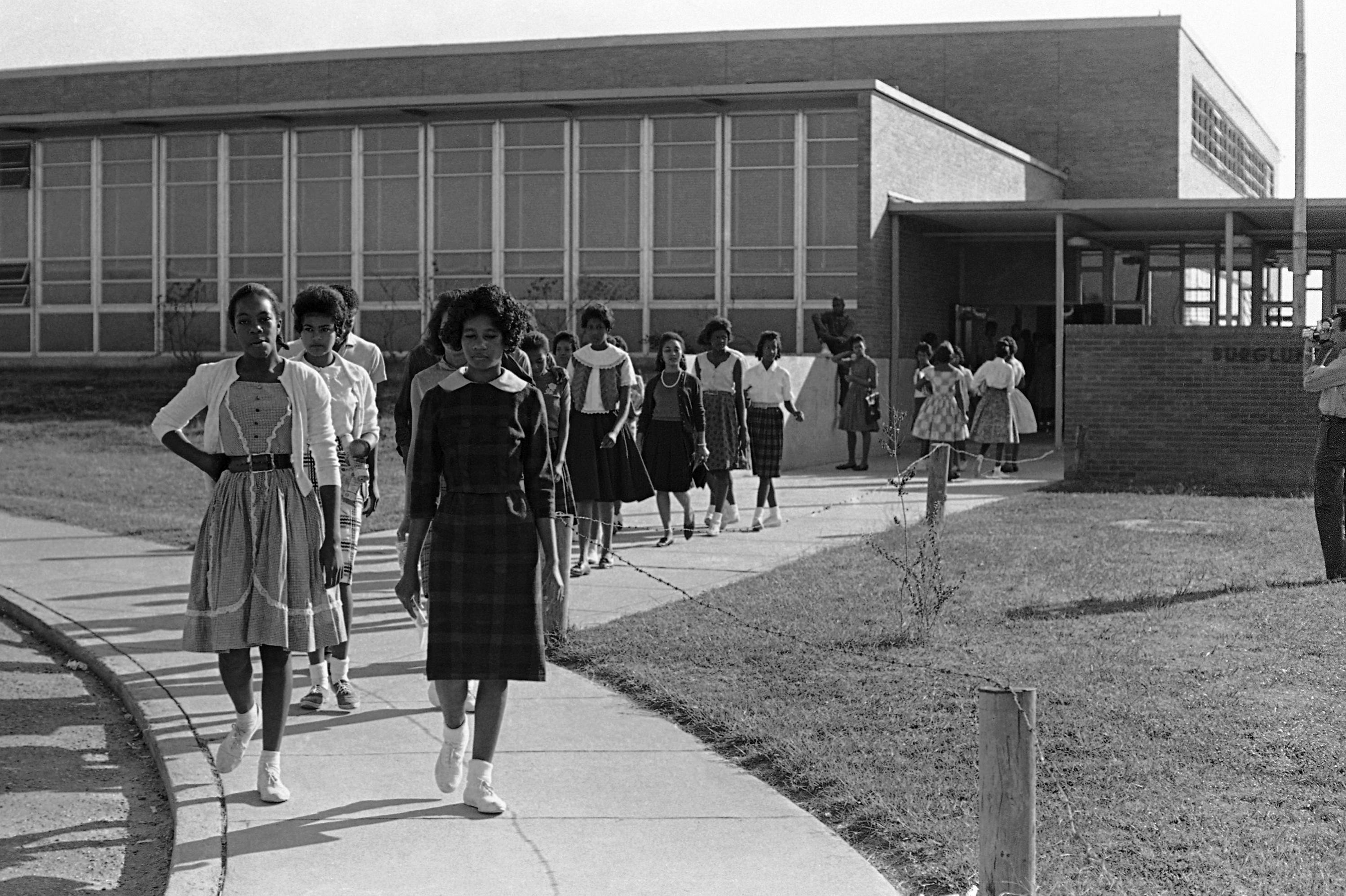 Black students walked out of Burglund High School in McComb, Miss., on Oct. 12, 1961. The walkout was the second in a month at the high school. On Oct. 4, 1961, more than 100 students walked out to protest the expulsion of fellow student Brenda Travis. Some students later refused to sign pledges that they would not participate in civil rights demonstrations and walked out of school in protest.