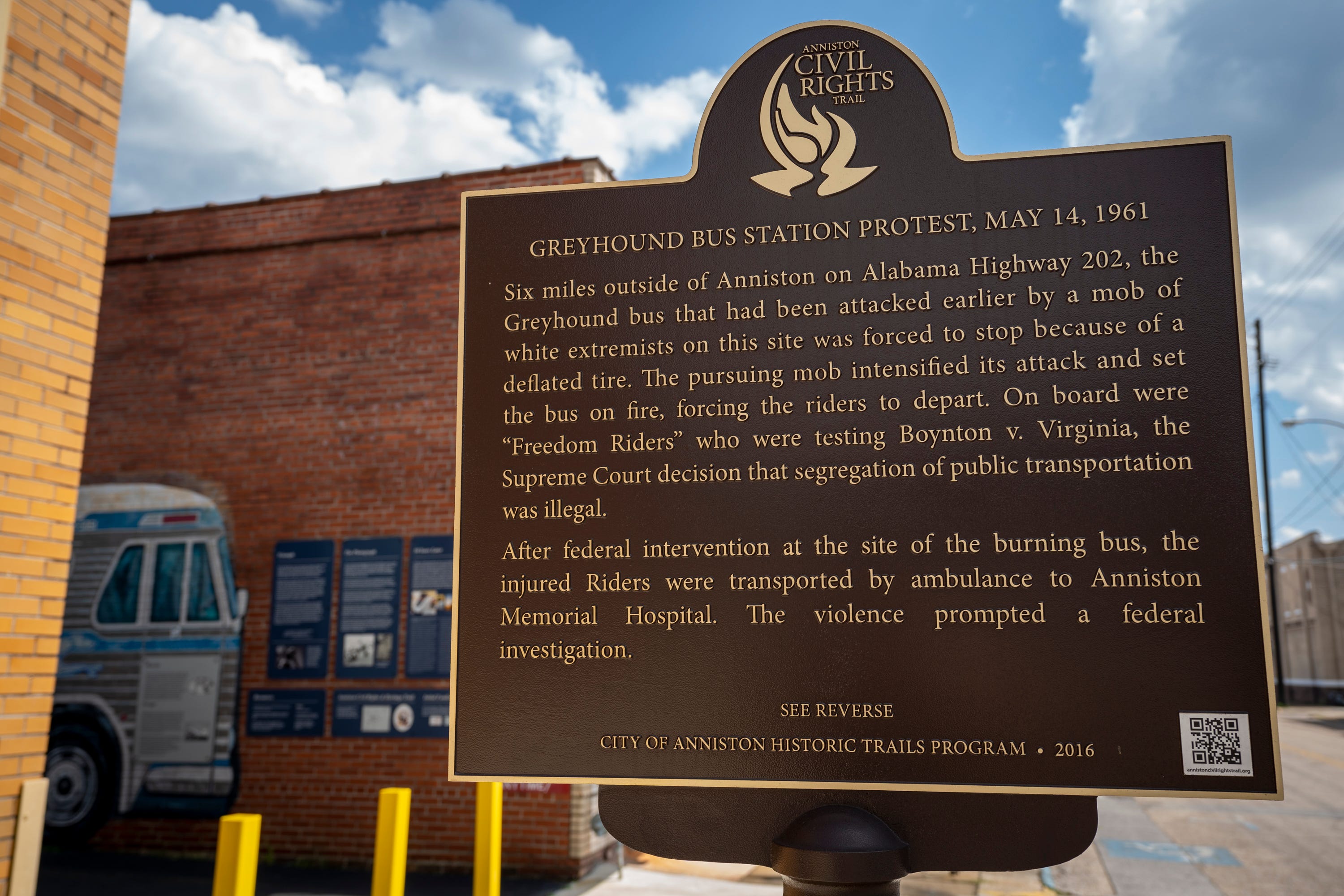 A historical marker describes what took place in the alley beside the Greyhound station where Freedom Riders were met by an angry mob in 1961, now preserved as the Freedom Riders National Monument, in Anniston, Ala., on August 13, 2021. Eleven days into the Freedom Rides aimed at ending segregation, Hank Thomas and other Freedom Riders huddled on a bus on May 14, 1961, just outside Anniston, Alabama, as a white mob slashed tires on their bus, pounded it with tire irons and then threw a firebomb inside. As flames spread, the civil rights activists scrambled off the bus into the angry crowd that beat them with bats, fists and those same tire irons. That brutal confrontation could have ended the group’s 14-day mission to desegregate public interstate accommodations. Instead, more Freedom Riders boarded buses headed into hostile territory. The rides focused attention on the violent resistance to segregation and are credited with helping integrate accommodations.