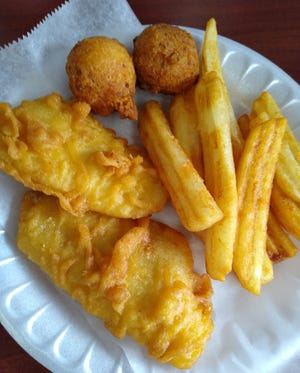 Arthur Treacher's Original Fish & Chips meal comes with two pieces of fish, English-style fried potatoes and two hushpuppies.