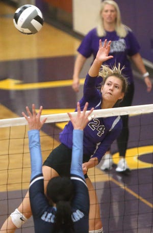 Jackson's McKenna Weber (24) goes for the kill during a game against Louisville last season.