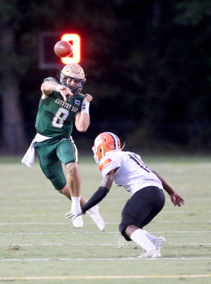 Savannah Country Day quarterback Barry Kleinpeter throws the ball down field over visiting Metter's Ethan Oglesby during a Sept. 10 game.