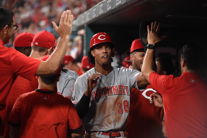 Cincinnati Reds shortstop Jose Barrero (38) is congratulated after scoring against the St. Louis Cardinals during the ninth inning at Busch Stadium in St. Louis on Sept. 10.