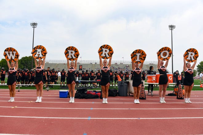 Washington cheerleaders spell their mascot, the Warriors, on Saturday, September 11, 2021 in the Presidents Bowl at Howard Wood Field in Sioux Falls.
