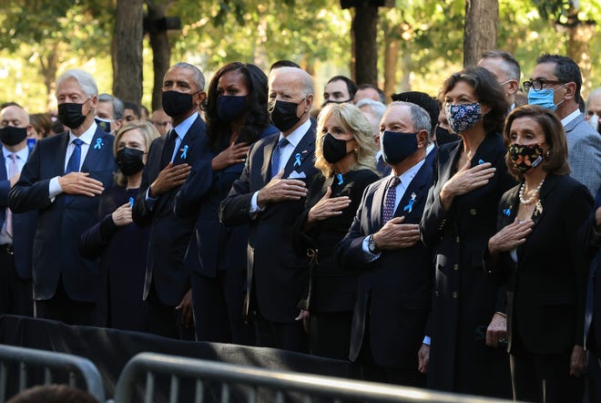 Former President Bill Clinton, Former First Lady Hillary Clinton, Former President Barack Obama, Former First Lady Michelle Obama, President Joe Biden, First Lady Jill Biden, Former New York Mayor Michael Bloomberg, Bloomberg's Partner Diana Taylor, and House Speaker Nancy Pelosi (D -CA) stand for the national anthem during the annual 9/11 memorial service at the National 9/11 Memorial and Museum on September 11, 2021 in New York City.