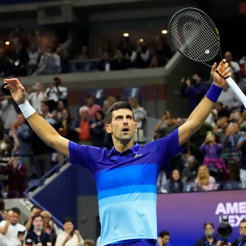 Novak Djokovic celebrates after match point agains