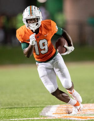 Florida A&M University wide receiver Xavier Smith (19) runs the ball during a game between Florida A&M University and Fort Valley State University at Bragg Memorial Stadium in Tallahassee on Saturday, September 11, 2021 .