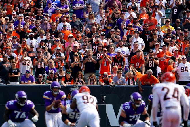 Cincinnati Bengals fans cheer on the defense as Minnesota Vikings quarterback Kirk Cousins (8) takes a snap in the third quarter during an NFL Week 1 football game, Sunday, Sept. 12, 2021, at Paul Brown Stadium in Cincinnati. The Cincinnati Bengals won, 27-24. 