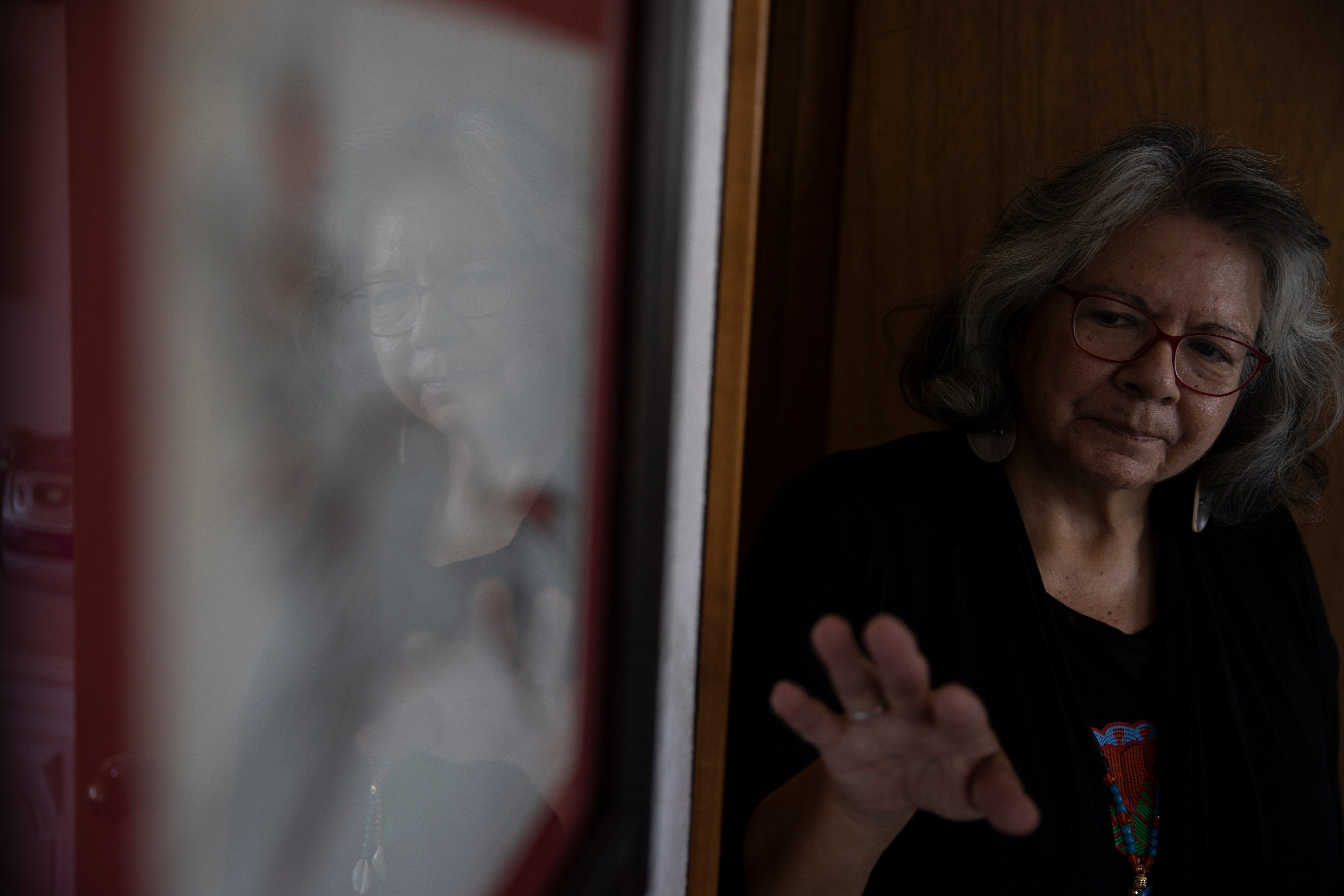 Dr. Robbie Paul shows off art she created in her home in Spokane, Washington, on Sept. 10.