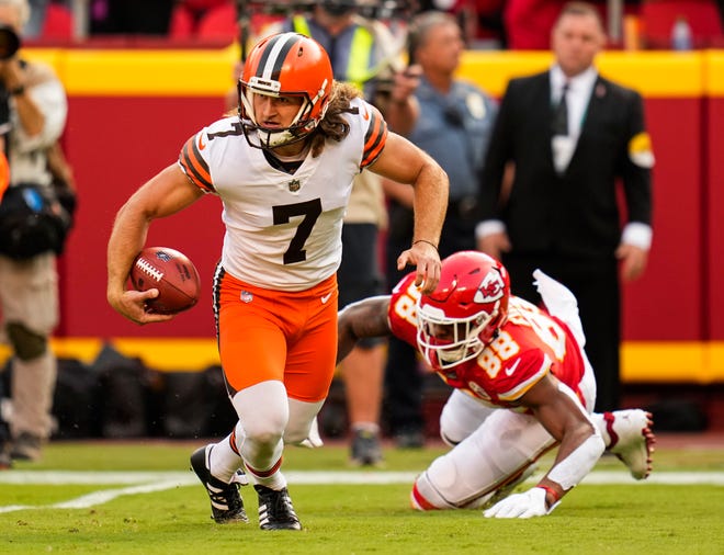 Browns punter Jamie Gillan scrambles away from Chiefs tight end Jody Fortson on Sunday.