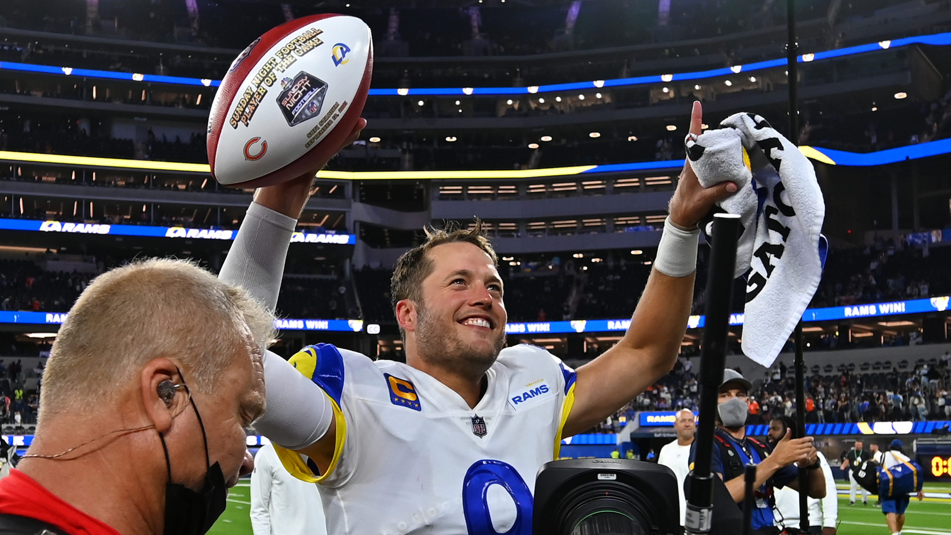 Matthew Stafford smiles as he leaves the field after the Rams' win over the Bears.