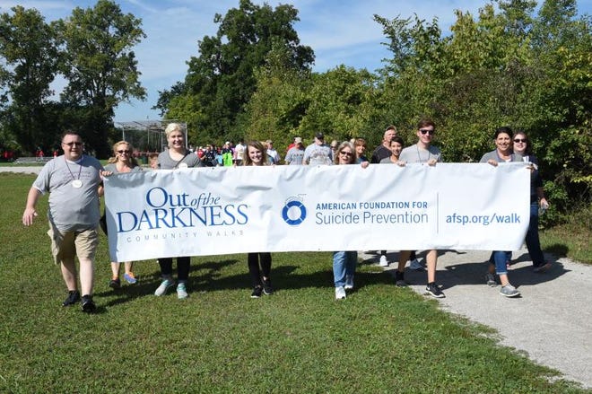Participants walk in the first “Bedford Out of the Darkness Walk” held in 2016. This year’s event is Sept. 25.