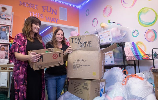 Alex Breaux, left, and sister-in-law Jessica Breaux, owners of Wonder World Toy Store and Baby Boutique in Medford, are running a month-long toy drive to help the Afghan refugees that are being housed at Joint Base McGuire-Dix-Lakehurst in Burlington County.