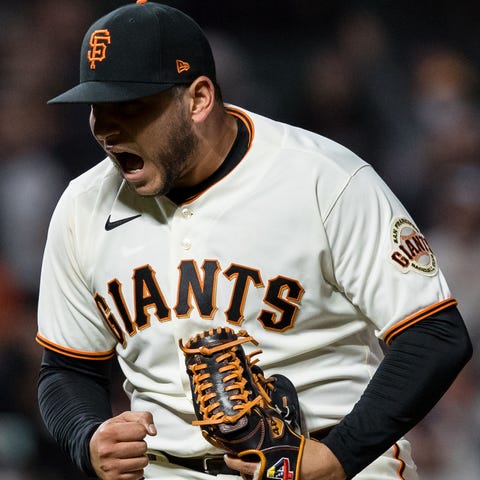 Giants relief pitcher Kervin Castro (reacts after 