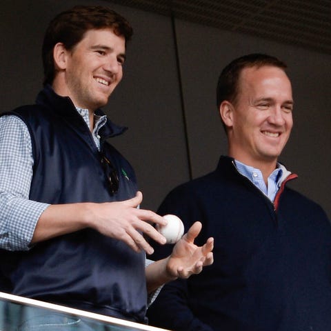 It surely appears former NFL QBs Eli Manning, left