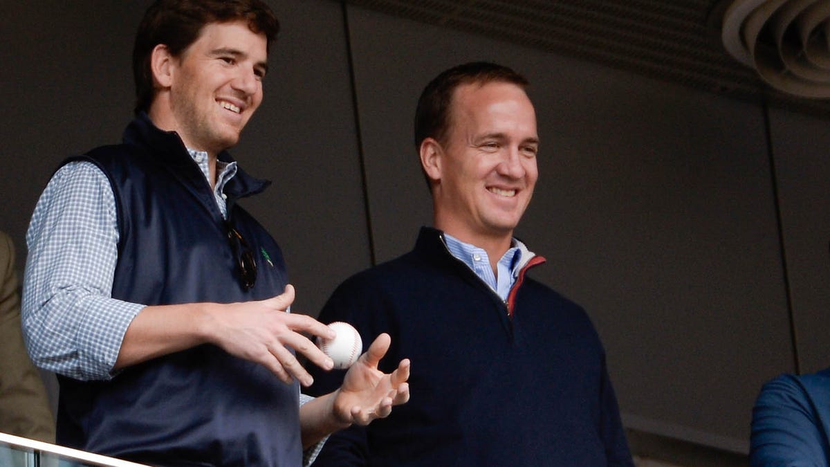 It surely appears former NFL QBs Eli Manning, left, and brother Peyton Manning have a rosy future in broadcasting.