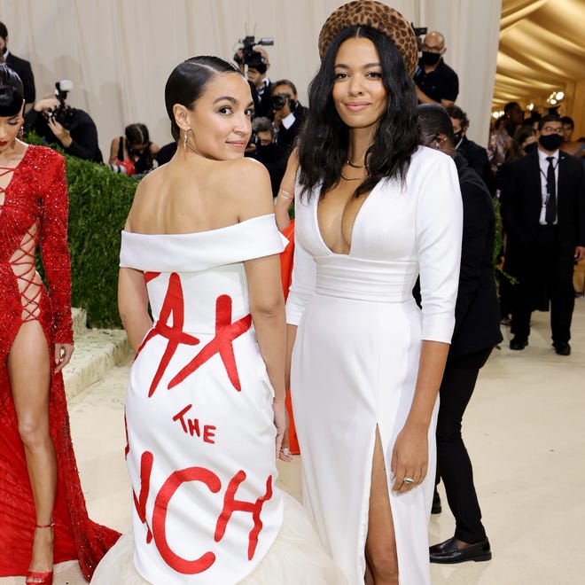 Rep. Alexandria Ocasio-Cortez (D-N.Y.), at left standing next to Aurora James, attends The 2021 Met Gala Celebrating In America: A Lexicon Of Fashion at Metropolitan Museum of Art on Monday, September 13, 2021 in New York City.