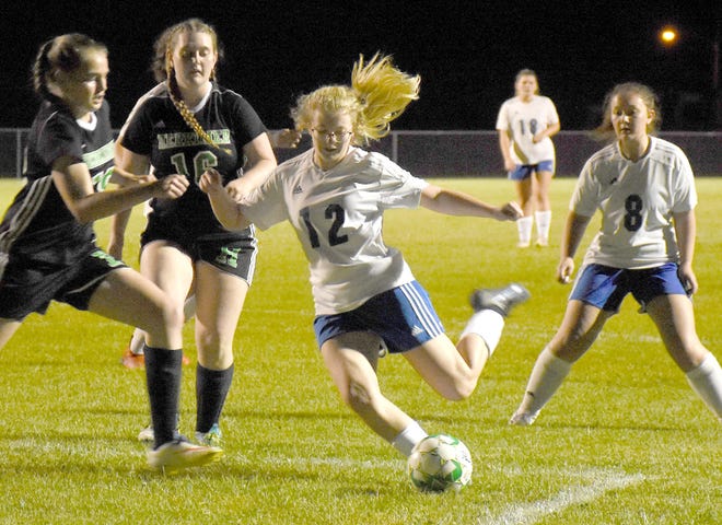 Dolgeville's Gianna Lyon (12) winds up to shoot on the play that produced her second goal against Herkimer during the first half of Tuesday's match.