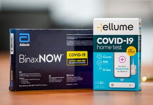 Two brands of at-home COVID-19 tests.