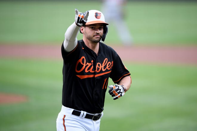 Baltimore Orioles' Trey Mancini celebrates his home run during the first inning of a baseball game against the Washington Nationals, Saturday, July 24, 2021, in Baltimore. (AP Photo/Nick Wass)