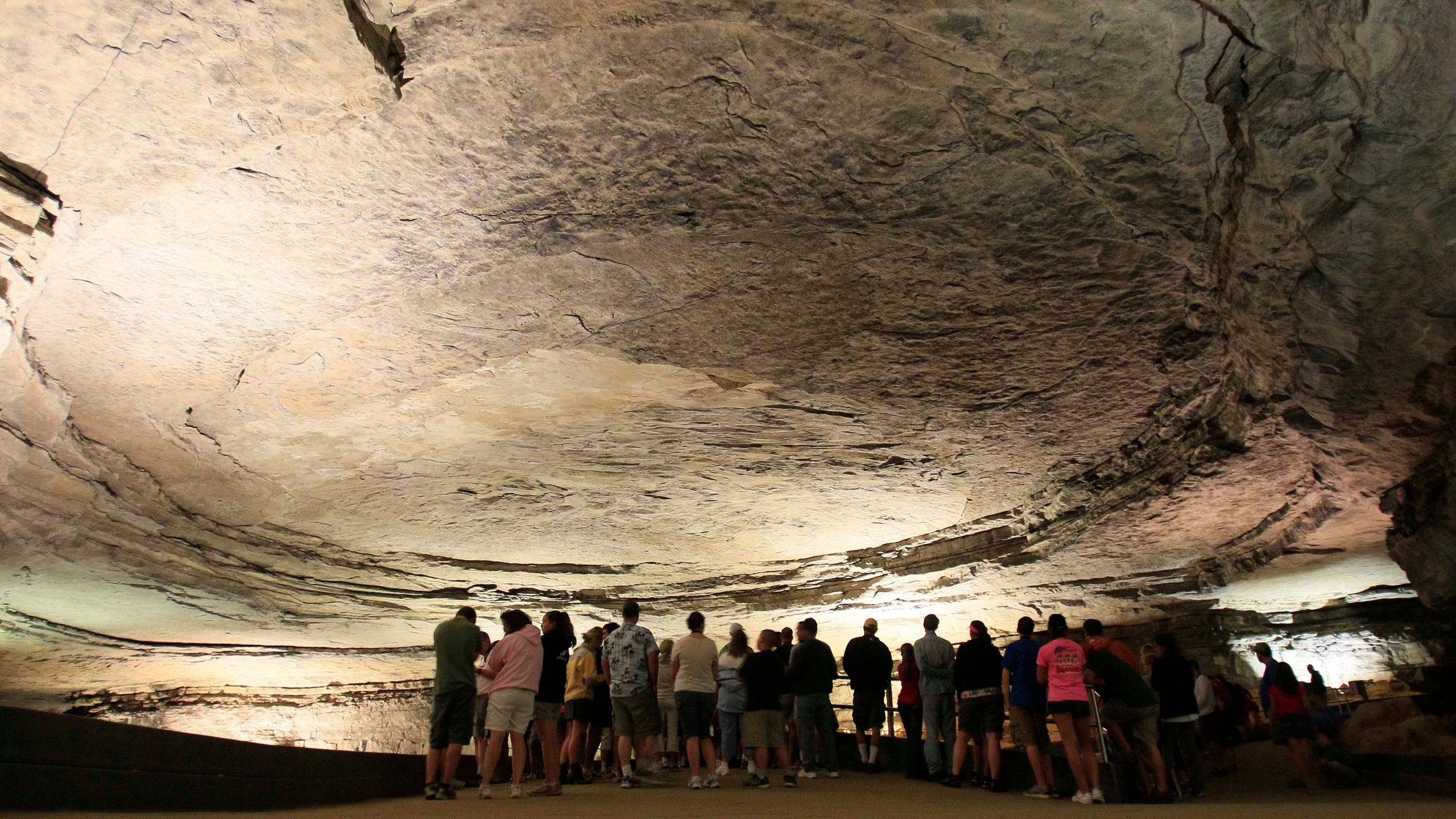 Tour participants marvel at the rotunda area of Mammoth Cave National Park in this file photo from August 2011.
