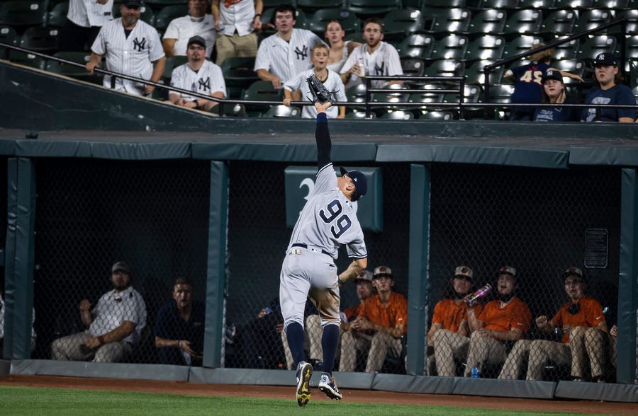 Sept. 14: New York Yankees outfielder Aaron Judge  makes a catch near the wall against the Baltimore Orioles during the eighth inning at Oriole Park at Camden Yards. The Yankees won the game, 7-2.
