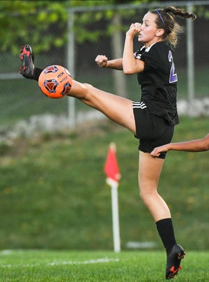 Bloomington South’s Melea Miller (21) barely misses connecting on a ball in the box during Wednesday's match against Bloomington North.