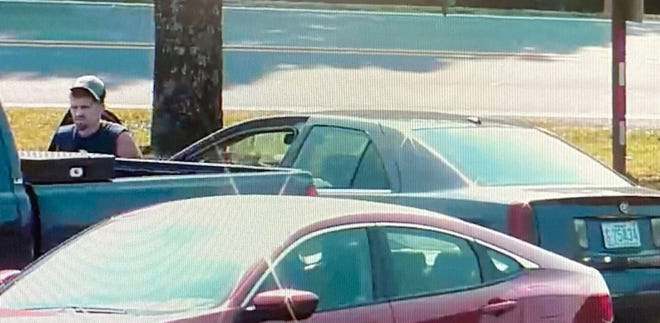 Security cameras captured this image of a man police say broke into two cars at Faith Baptist Church on Sunday.