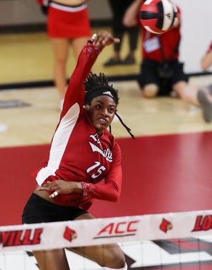 U of L's Aiko Jones (15) spikes against UK during their match at the L&N Arena in Louisville, Ky. on Sep. 15, 2021.