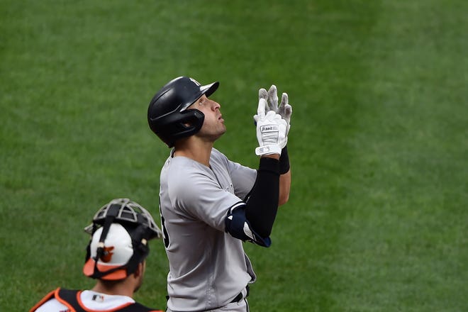 New York Yankees' Joey Gallo reacts after hitting a solo home run against the Baltimore Orioles in the second inning of a baseball game Thursday, Sept. 16, 2021, in Baltimore. (AP Photo/Gail Burton)
