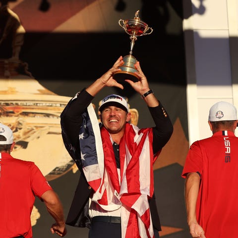 Brooks Koepka celebrates with the Ryder Cup in 201