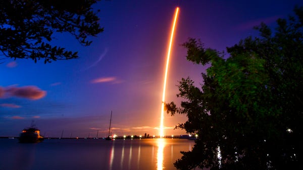 The launch of a SpaceX  Crew Dragon capsule atop a