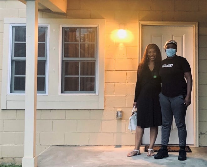 Cassandra Walton, case manager for the CSRA Economic Opportunity Authority, left, with factory worker Augusta Lakeyia Scott at Scott’s new home in Olde Town.  Scott struggled with homelessness for years before finding a home in Augusta.