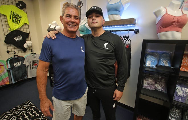 Owners Frank Stewart and his son Christian Stewart pose inside their new clothing and apparel store 1Enemy on Separk Circle in Gastonia.