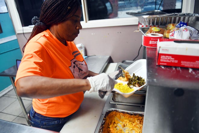 Patricia Hearns prepares a plate of food in her restaurant, NuNu's Sweet Soul Food at 3210 Orange Ave. in Fort Pierce. Hearns started her culinary dream in a food truck in January 2019. As she gained more experience over the next year, Hearns transitioned into a brick-and-mortar location in August 2020.