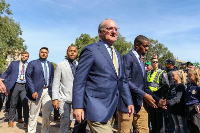 Notre Dame athletic director Jack Swarbrick walks with the Irish football team during the player walk before the Notre Dame-Bowling Green game. Saturday, Oct. 5, 2019, at Notre Dame Stadium.