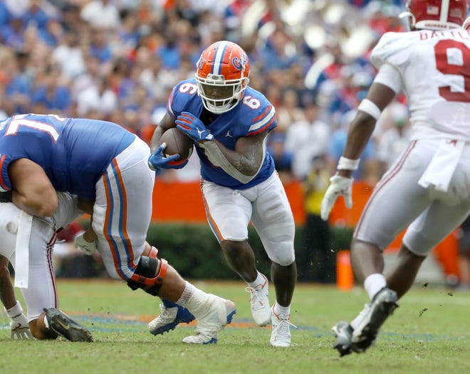 Florida's offensive line springs running back Nay'Quan Wright for a gain Saturday against Alabama at Ben Hill Griffin Stadium.