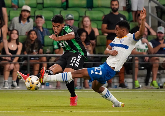 Austin FC forward Rodney Redes, left, takes a shot as San Jose Earthquakes' Marcos Johan Lopez defends during Austin's 4-3 loss Saturday at Q2 Stadium. The team gave up a two-goal advantage at halftime in the defeat.