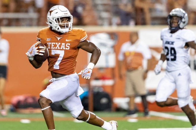 Texas running back Keilan Robinson looks back on his way to scoring a touchdown in the win over Rice in September. With the Longhorns' top two backs, Bijan Robinson and Roschon Johnson, both considered game-time decisions, the transfer from Alabama could be in line for more carries against Kansas.