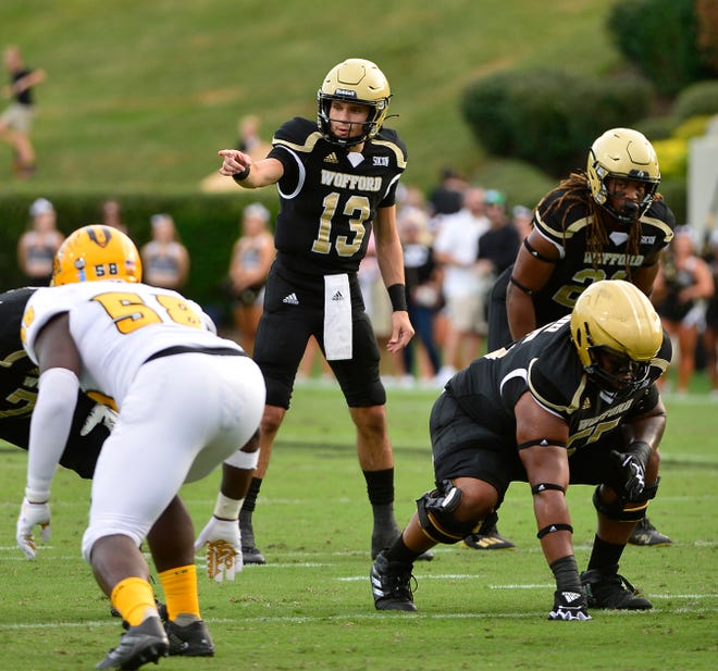 Wofford College played Kennesaw State University in college football on Sept. 18, 2021.  Wofford's Peyton Derrick (13) QB calls a play on the field. 