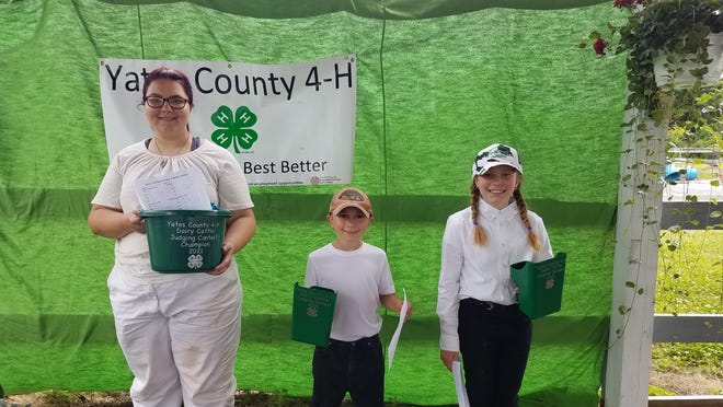 Ginny Savage, Jacob Martens, and Leila Martens – 4-H Dairy Judging Contest participants.